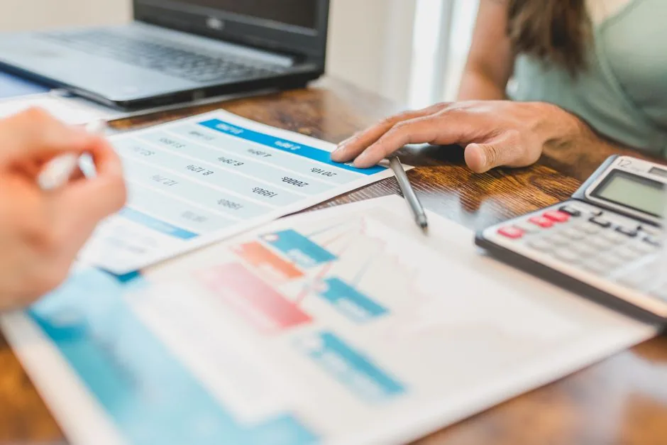 An e-commerce manager analyzing profit margins on a laptop to avoid hidden Amazon FBA calculator fees.