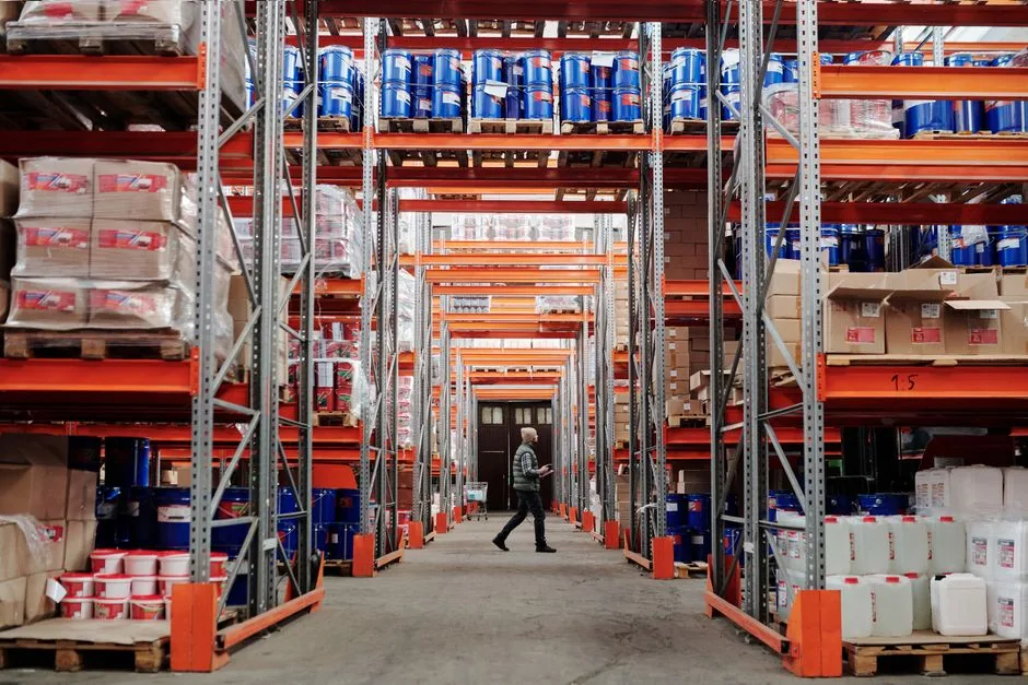 Image showing Dollar General distribution center with AI-driven forecasting screens, illustrating automated inventory management for retailers and suppliers