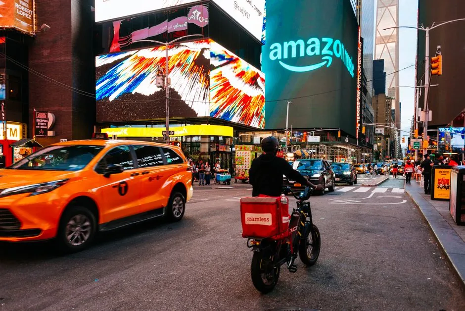 Business professional reviewing Amazon ad compliance data on a laptop, highlighting regulatory risks for advertisers