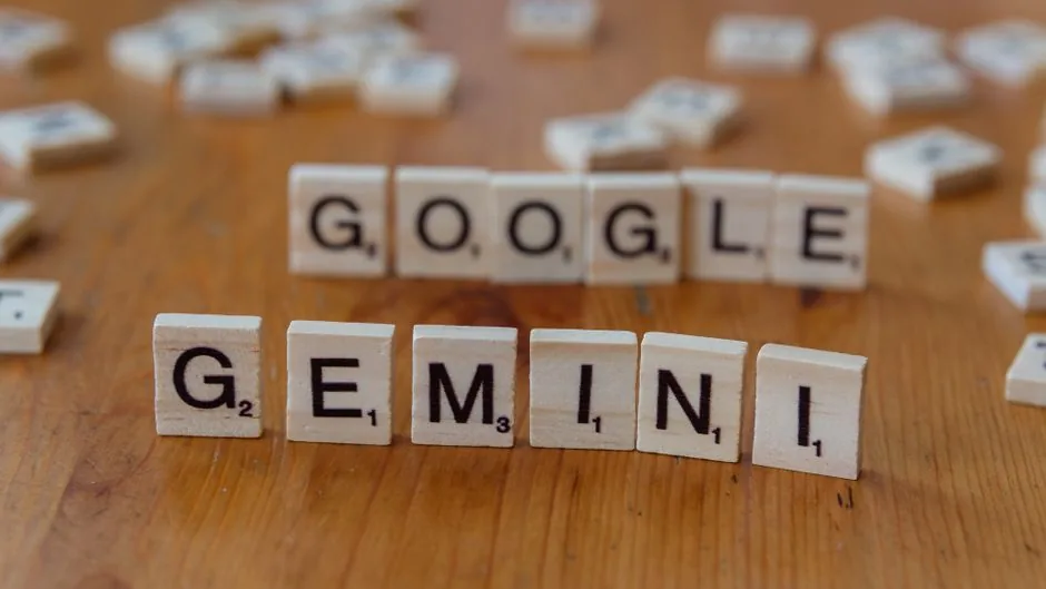 A software developer analyzing API cost reductions on a laptop screen featuring Google Gemini model updates for tech enterprises.