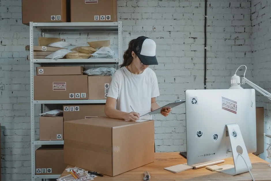 Brand manager reviewing Walmart Seller Central dashboard while syncing inventory and pricing data across Shopify for a multi‑channel ecommerce strategy