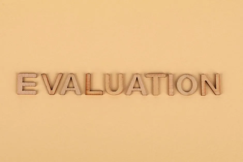 A catalog manager overwhelmed by multiple browser tabs using AMZ Evaluator, illustrating the outdated manual workflow for Amazon listing optimization