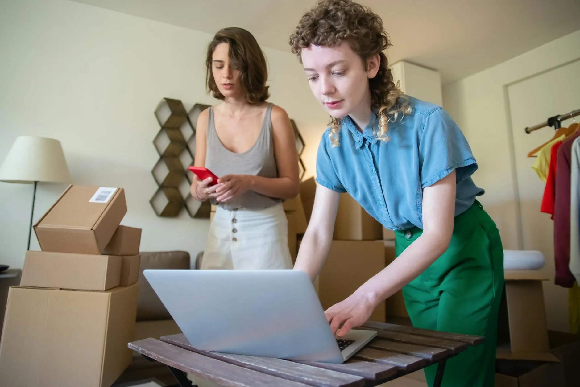 Amazon seller reviewing advertising cost data on laptop — CPC benchmarks and bidding strategy guide for brand managers