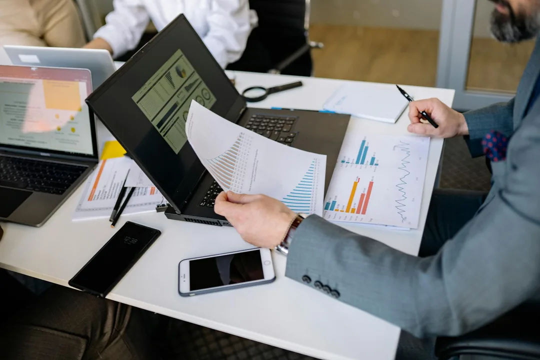 Brand manager reviewing Amazon Brand Store analytics on laptop — Vendor Central storefront setup and optimization guide