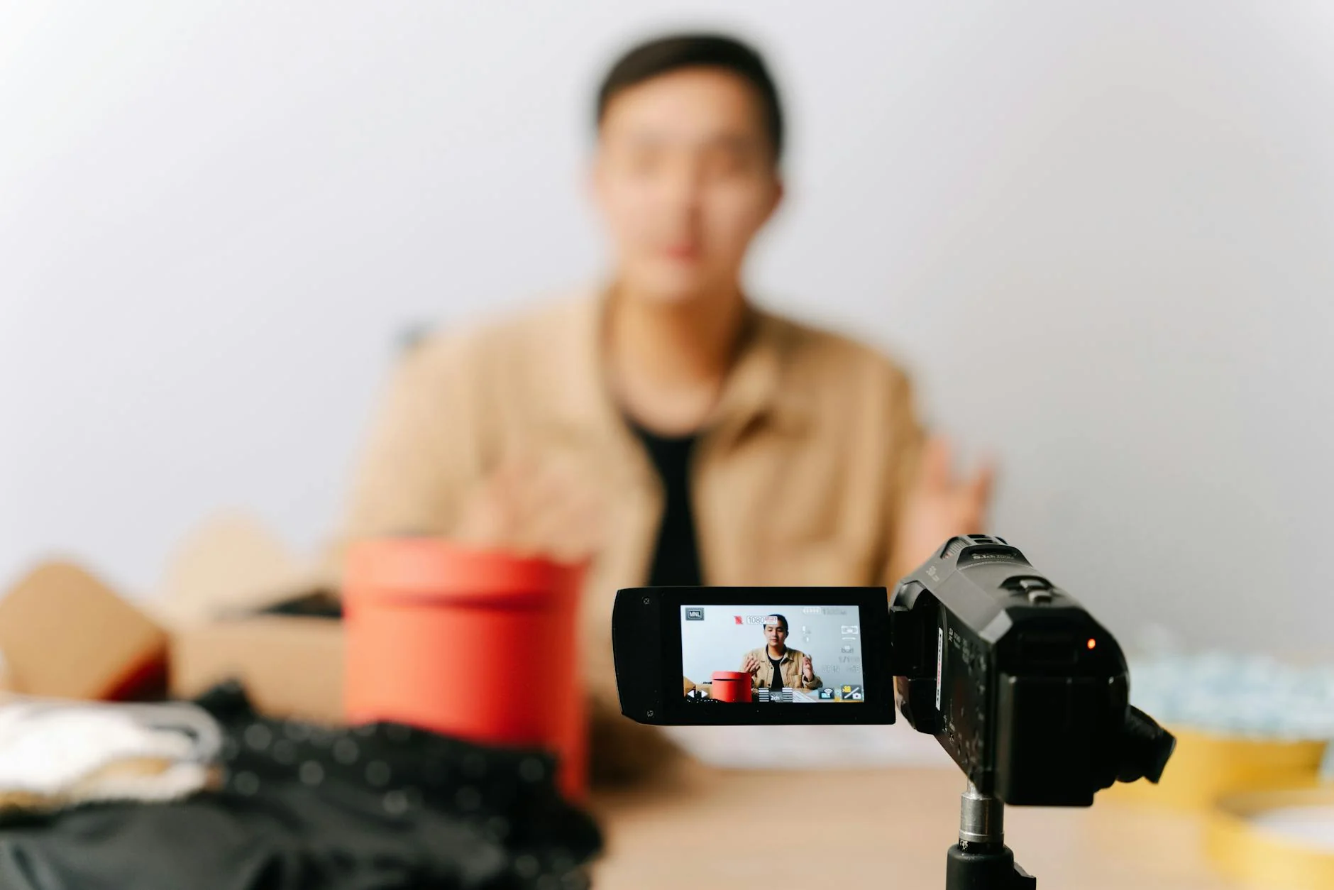 Content creator recording ecommerce product video with AI avatar tools — CapCut guide for brand managers