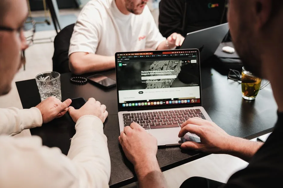 Ecommerce content team reviewing AI-generated product descriptions on laptop screen — guide to choosing the right AI generator for catalog scale