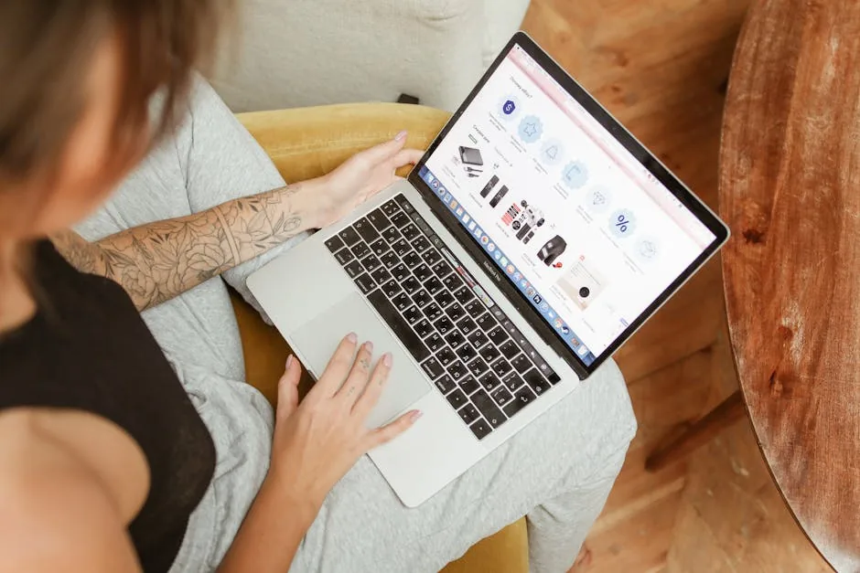 Entrepreneur building an AI-powered ecommerce website on laptop — comparison guide to free ecommerce AI website builders for brand managers
