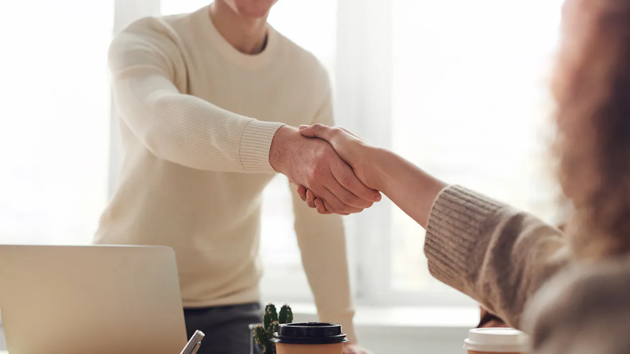Brand manager reviewing Amazon Vendor Central contract terms — wholesale supply chain strategy for retailers