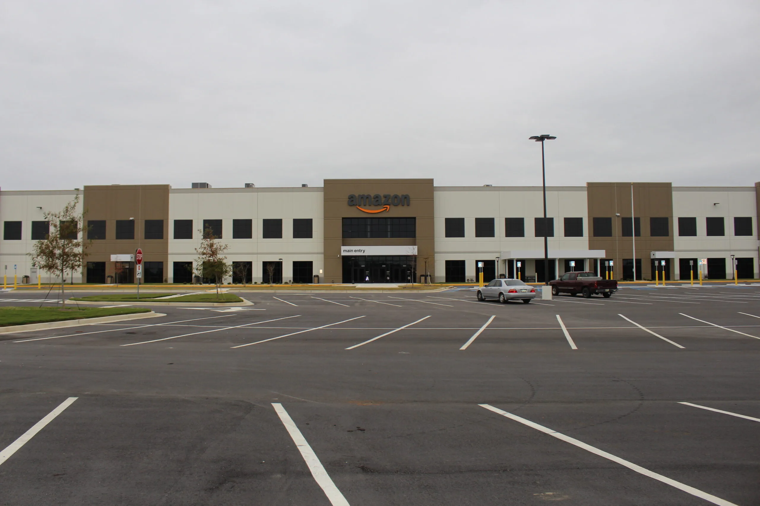 Amazon fulfillment center exterior — Epinium Vendor Stock Forecast for 1P brand replenishment planning