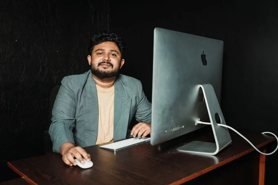 An e-commerce specialist analyzing real-time Amazon advertising metrics on a dashboard to optimize campaigns for brand sellers.
